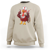 Sand sweatshirt with turkey nurse graphic holding stethoscope-style accessory, crewneck long sleeves