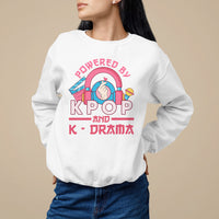 White sweatshirt with large "POWERED BY K-POP" and "K-DRAMA" graphic