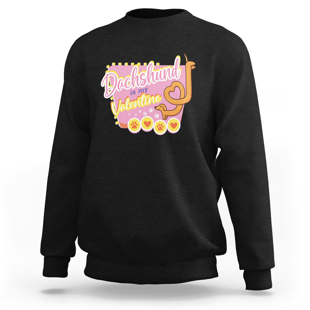 Black crewneck sweatshirt with dachshund Valentine graphic and heart accents