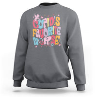 Charcoal crewneck sweatshirt with "Cupid's Favorite Nurse" graphic in pink, blue, and yellow