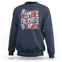 Navy crewneck sweatshirt with "Cupid's Favorite Nurse" text graphic and small cupid figures