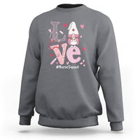 Charcoal gray sweatshirt with nurse gnome graphic, hearts, and #NurseSquad text