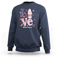 Navy sweatshirt with nurse gnome graphic, hearts, and #NurseSquad text