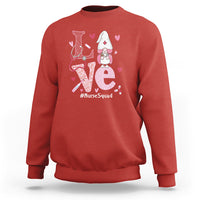 Red sweatshirt with nurse gnome graphic, hearts, and #NurseSquad text