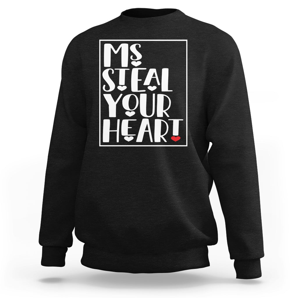 Women's black sweatshirt with “Ms Steal Your Heart” graphic and red heart
