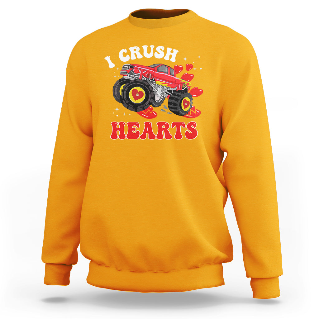 Gold crewneck sweatshirt with monster truck graphic and red heart text