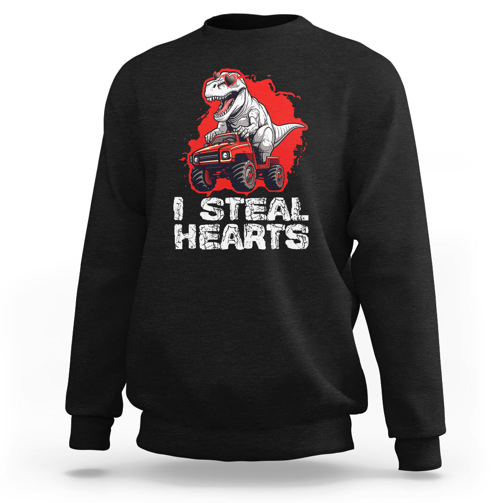Black sweatshirt with dinosaur on monster truck graphic and 'STEAL HEARTS' text