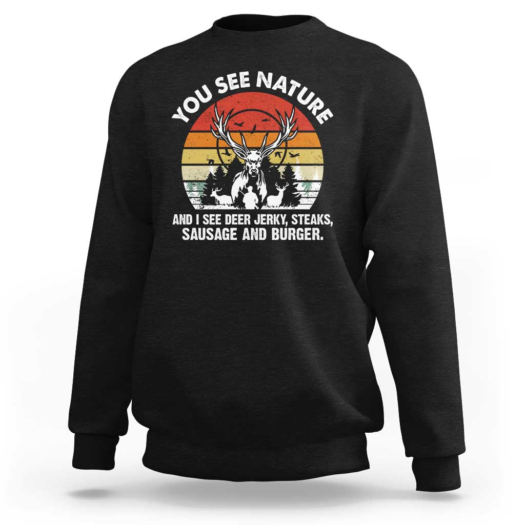 Black sweatshirt with deer head graphic and “YOU SEE NATURE” slogan