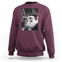 Maroon sweatshirt with cat-and-Santa graphic print on the back