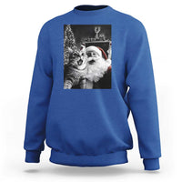 Royal blue sweatshirt with cat-and-Santa graphic print on the back