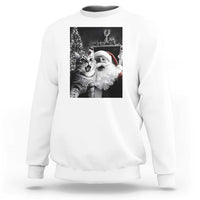 White sweatshirt with cat-and-Santa graphic print on the back