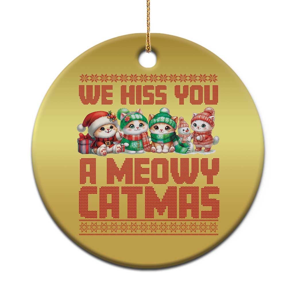 Gold round cat Christmas ornament with “WE HISS YOU A MEOWY CATMAS” text and cats.