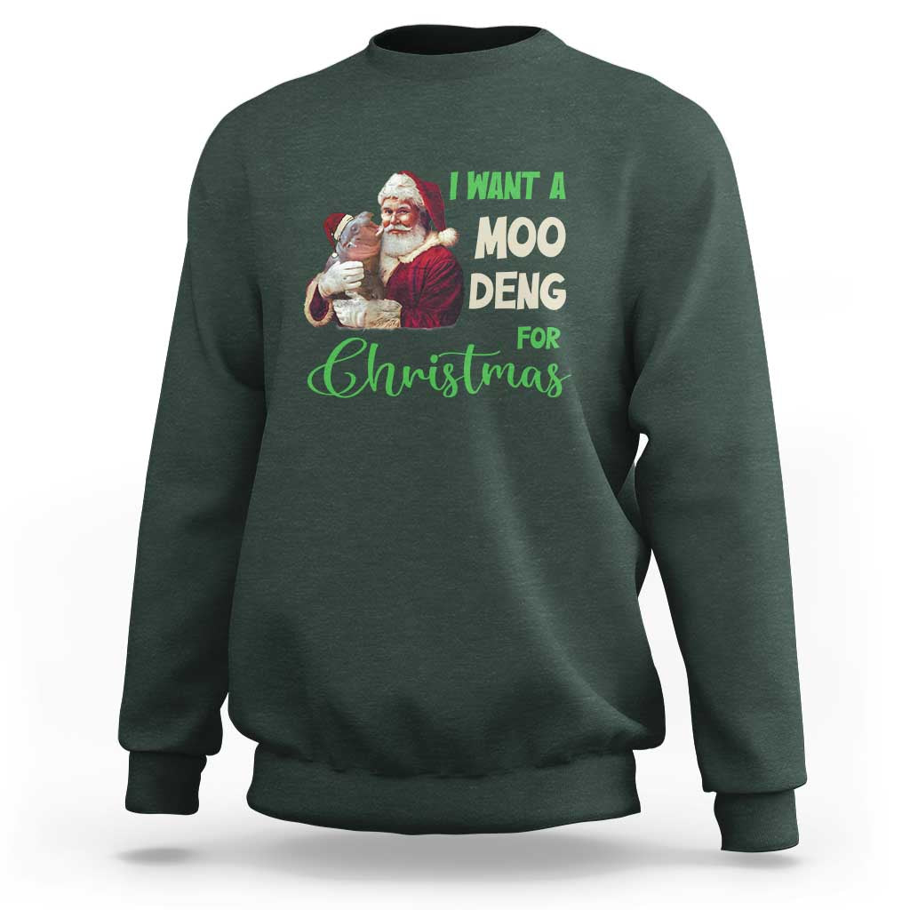 Moo Deng Christmas sweatshirt, dark forest green, front graphic with Santa and text 'I WANT A MOO DENG'