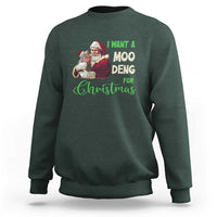 Moo Deng Christmas sweatshirt, dark forest green, front graphic with Santa and text 'I WANT A MOO DENG'