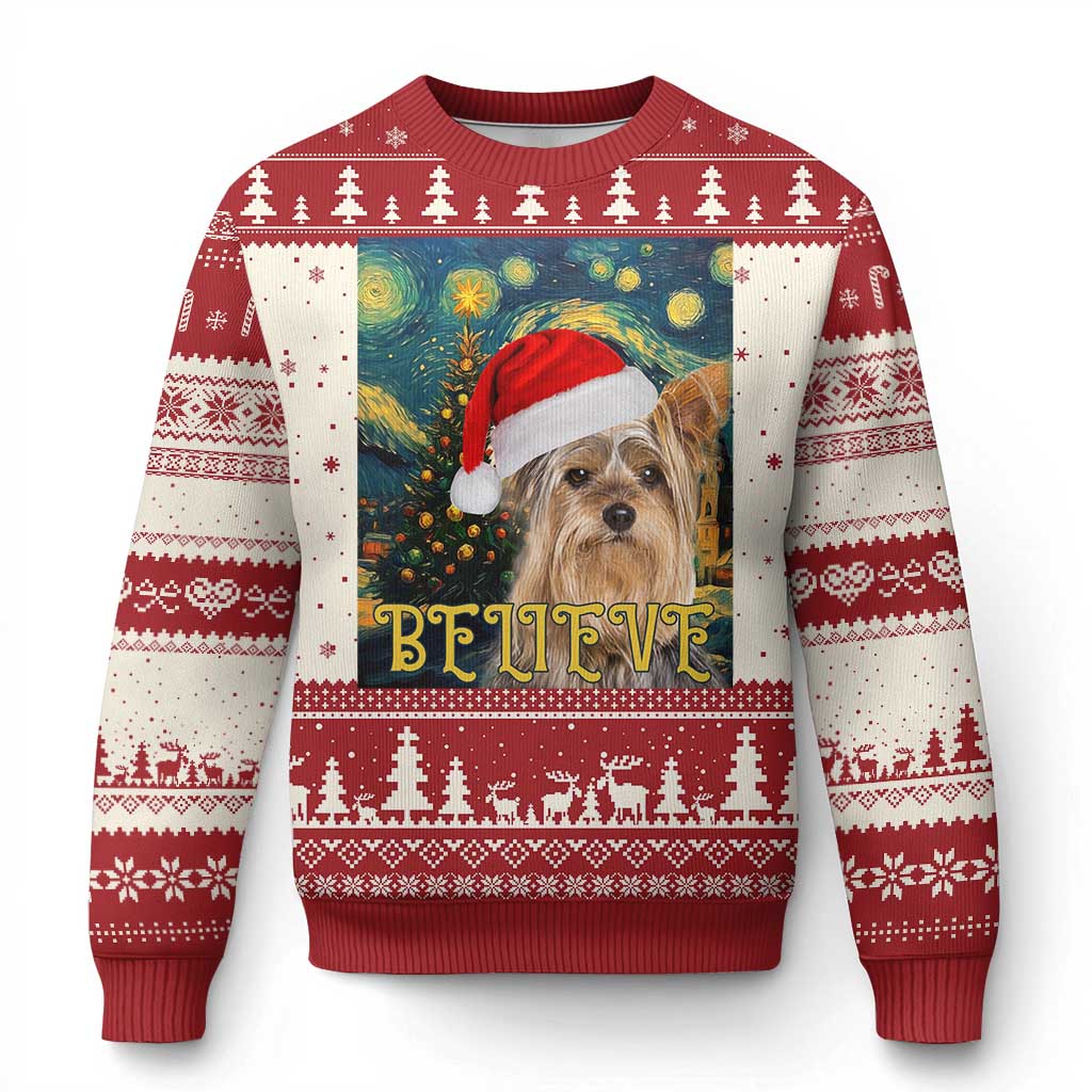 Red Christmas sweater with dog in Santa hat and "BELIEVE" starry night graphic