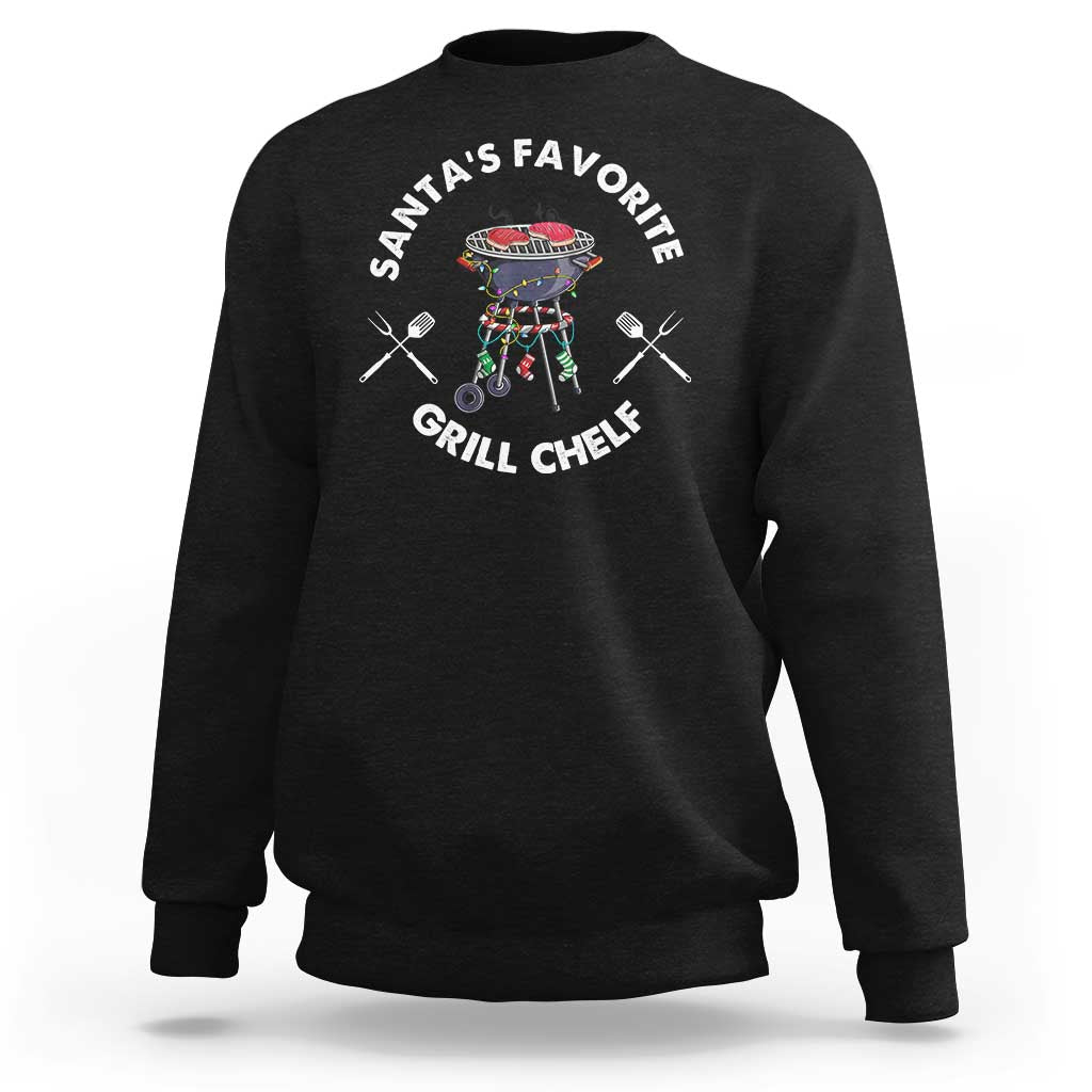Black crewneck sweatshirt with BBQ chef graphic and “Santa’s Favorite Grill Chef” text.