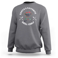 Gray crewneck sweatshirt with BBQ chef graphic and “Santa’s Favorite Grill Chef” text.