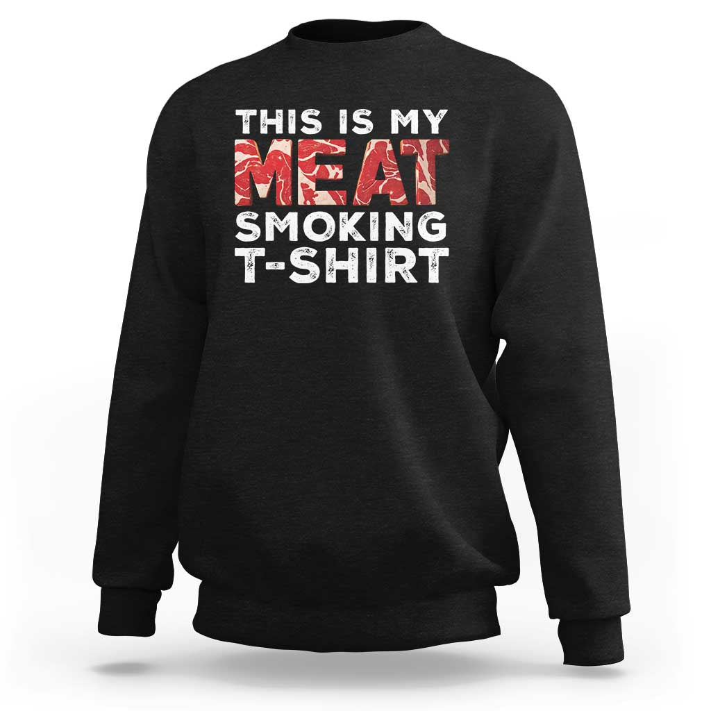 Black sweatshirt with front text graphic "THIS IS MY MEAT SMOKING T-SHIRT".