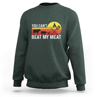 Dark forest green crewneck sweatshirt with 'YOU CAN'T BEAT MY MEAT' grill graphic