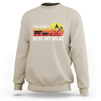 Sand crewneck sweatshirt with 'YOU CAN'T BEAT MY MEAT' grill graphic