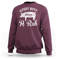Maroon sweatshirt with white pig grill graphic and script “A Rub” print on chest
