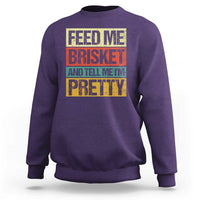 Purple BBQ graphic crewneck sweatshirt, 'FEED ME BRISKET' print
