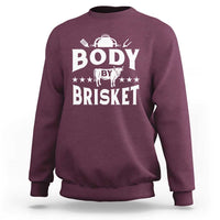 Maroon crewneck BBQ sweatshirt with large “BODY BY BRISKET” graphic on chest
