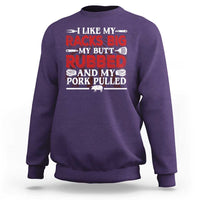Purple crewneck sweatshirt with BBQ pitmaster slogan graphic on back