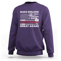 Purple crewneck sweatshirt with grilling tool graphic and “Make Grilling Great Again” text