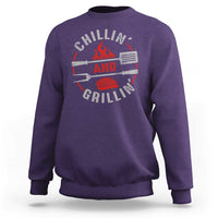 Purple crewneck sweatshirt with long sleeves and back BBQ grill graphic print