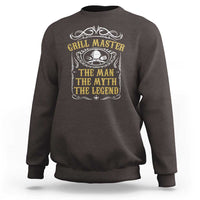 Dark chocolate crewneck sweatshirt with grill master emblem and “the myth” text graphic on chest