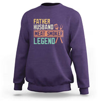 Men's purple crewneck sweatshirt with 'Meat Smoker' retro graphic on chest