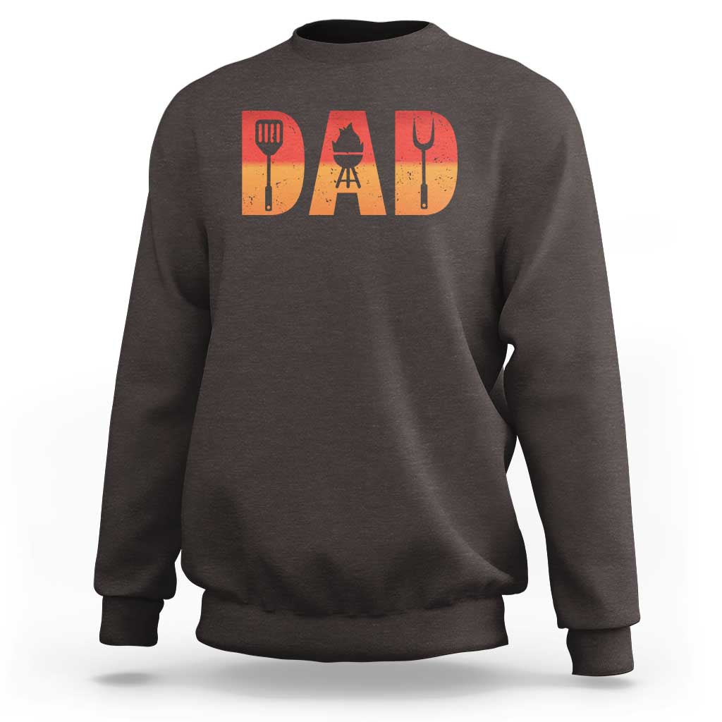 Dark brown crewneck dad BBQ grill sweatshirt with orange 'DAD' graphic