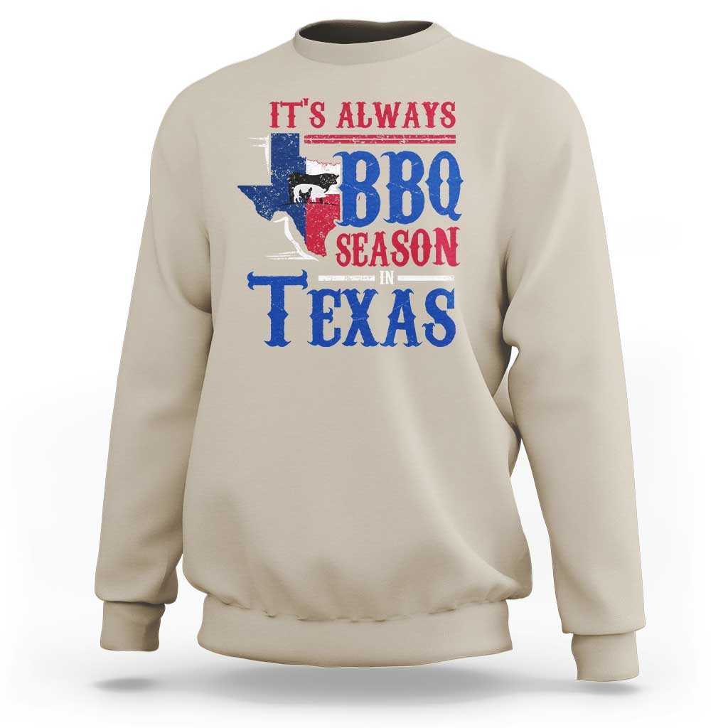 Sand crewneck sweatshirt with colorful Texas BBQ Season graphic on back.