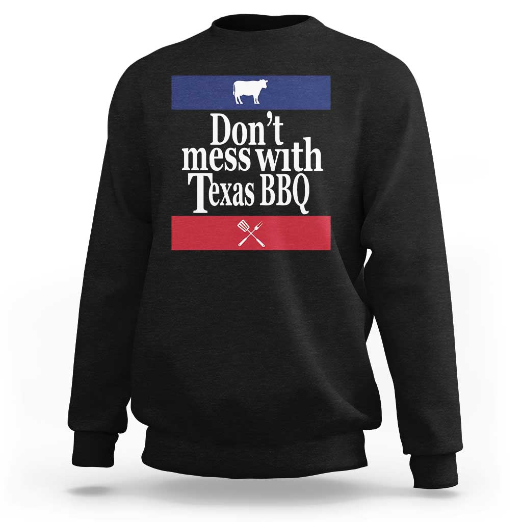 Black BBQ sweatshirt with chest graphic reading “Don’t mess with Texas BBQ”