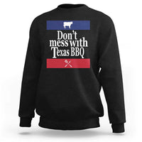 Black BBQ sweatshirt with chest graphic reading “Don’t mess with Texas BBQ”