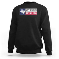 Black crewneck sweatshirt with Texas BBQ text and Texas map graphic on the chest.