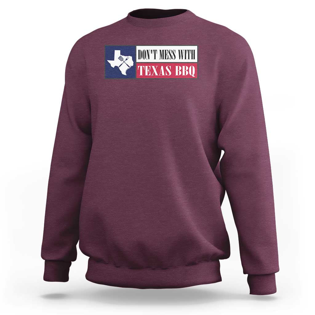 Maroon crewneck sweatshirt with Texas BBQ text and Texas map graphic on the chest.