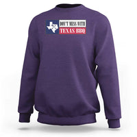 Purple crewneck sweatshirt with Texas BBQ text and Texas map graphic on the chest.