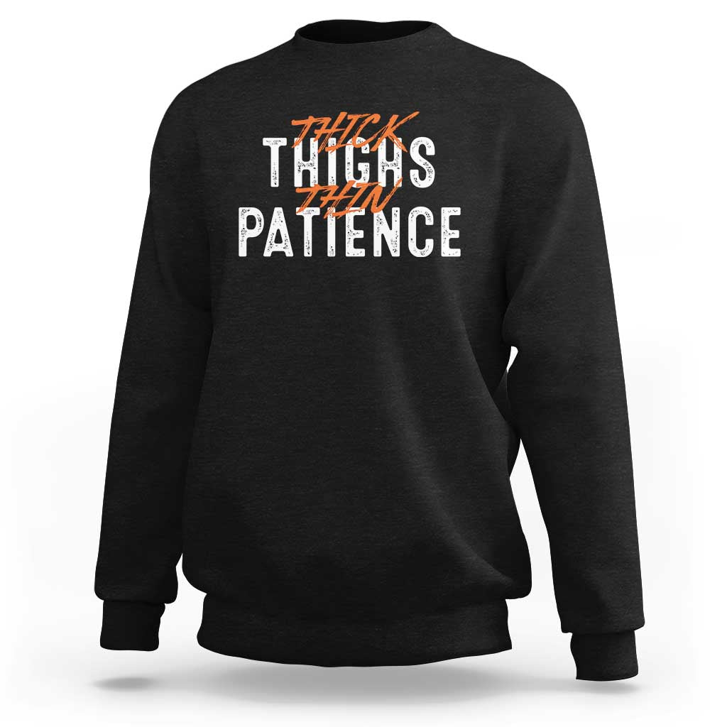 Black crewneck sweatshirt with back "Thick Thighs Patience" graphic