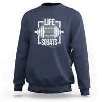 Navy crewneck sweatshirt with white “Life…Squats” graphic on the chest.