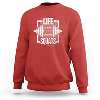 Red crewneck sweatshirt with white “Life…Squats” graphic on the chest.