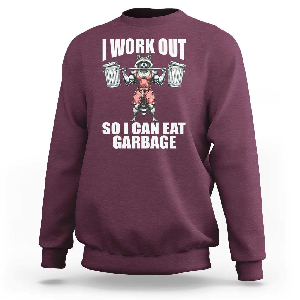 Maroon workout sweatshirt with front raccoon graphic and bold text print