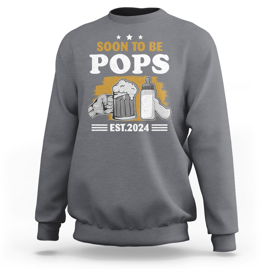 Dad announcement sweatshirt in charcoal gray with “SOON TO BE POPS” graphic and “EST.2024” text