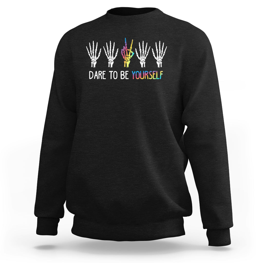 Black crewneck sweatshirt with skeleton-hand rainbow graphic and "DARE TO BE YOURSELF"