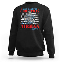 Dark crewneck sweatshirt with festive graphic text and aircraft design on chest
