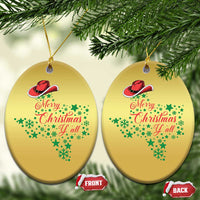 Two gold oval Christmas ornaments with cowboy hat and "Merry Christmas Y'all" lettering.