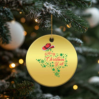 Gold round Christmas ornament with cowboy hat and "Merry Christmas Y'all" lettering.