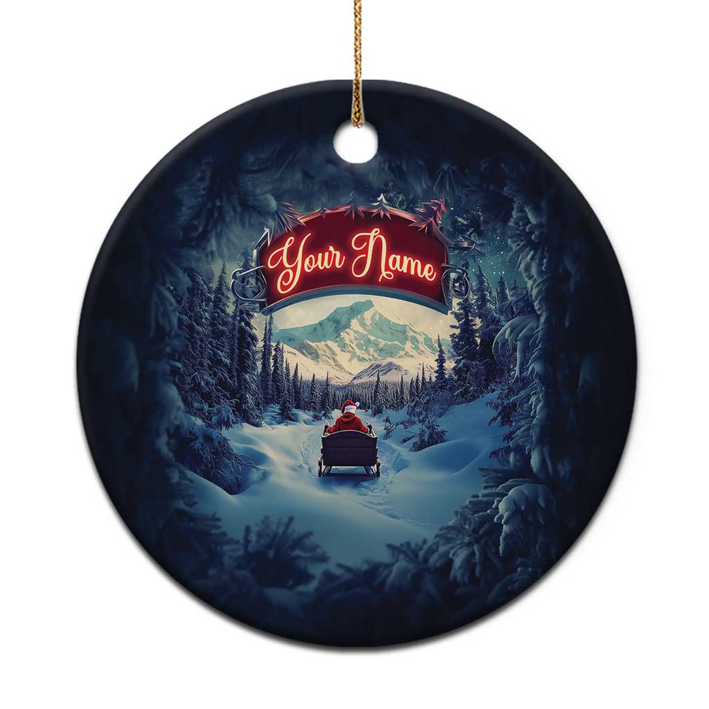 Navy round personalized Christmas ornament with Santa sleigh scene and hanging gold loop