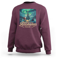 Maroon crewneck sweatshirt with winter aurora 'Alaskamas Magic' front graphic